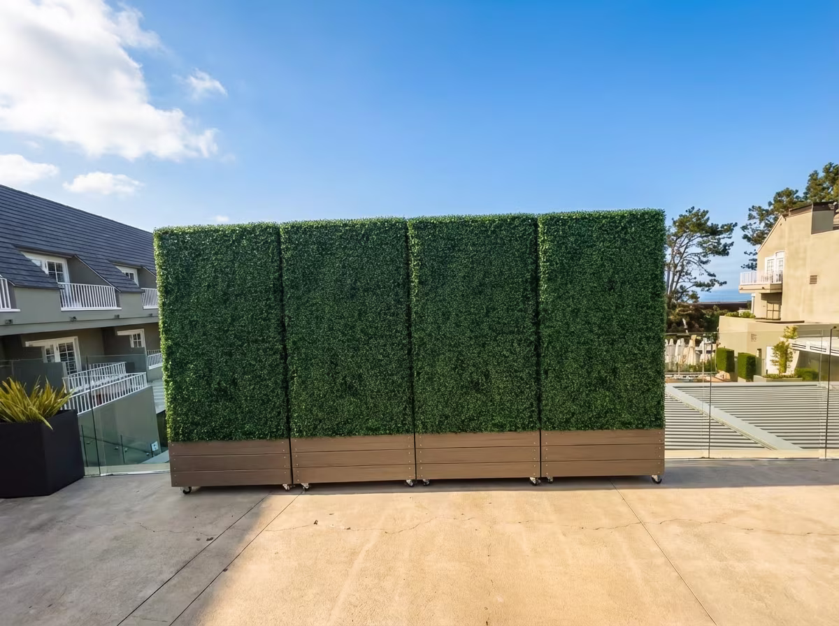 Del Mar Hotel artificial hedge installation showing hedge panels